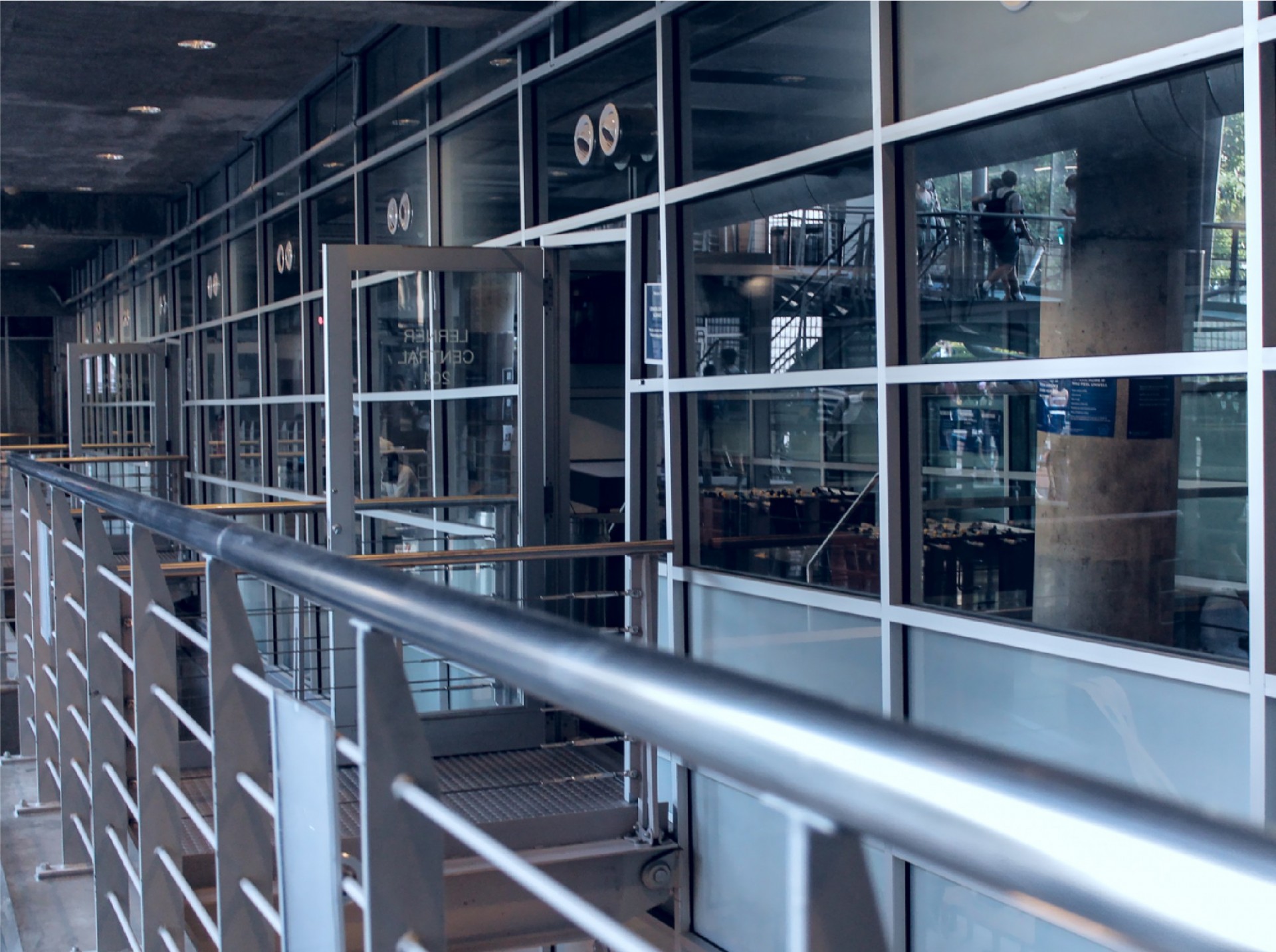 Lerner Hall upper floor with glass windows looking into a conference room