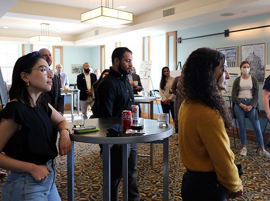 People gather in Faculty House for an event